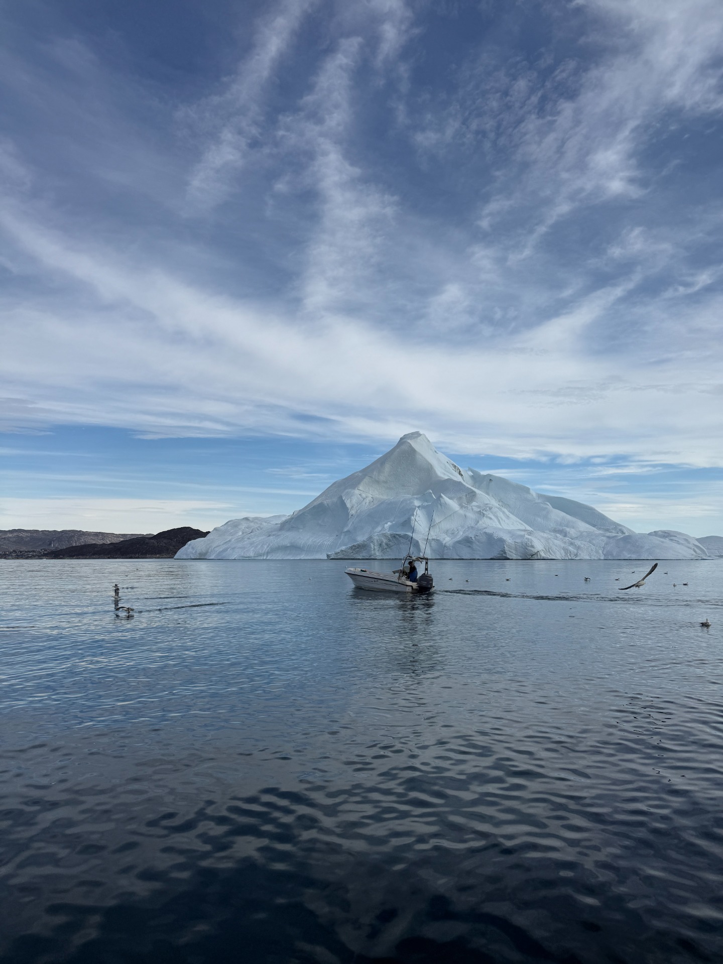 Experience the heart of the ice on a unique boat trip in the Icefjord – a calm, immersive, and personal voyage among majestic icebergs amidst Greenland’s magnificent Arctic landscape.